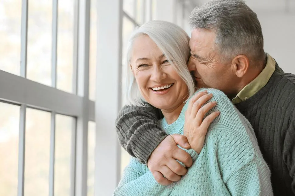 A joyful older Canadian couple at home